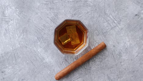 Whiskey-or-brandy-in-a-glass-with-Cuban-cigar
