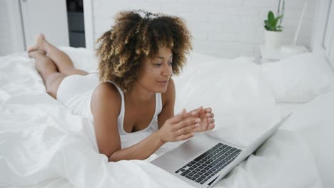 Young-model-with-laptop-in-bed