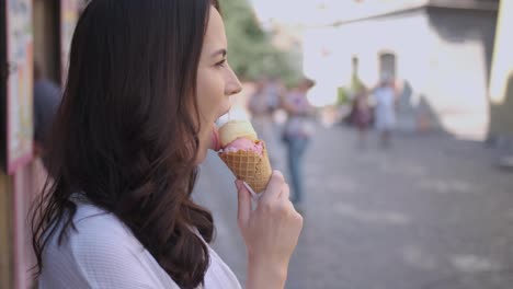 Beautiful-brunette-woman-eating-delicious-and-sweet-ice-cream