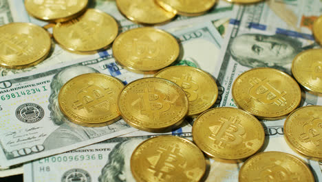 Shiny-golden-bitcoins-with-banknotes